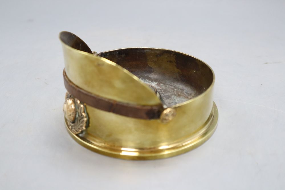 A Trench Art Army cap ashtray marked 1916, diameter 13cm